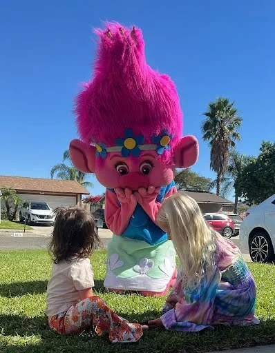Pink Troll party character in Boise